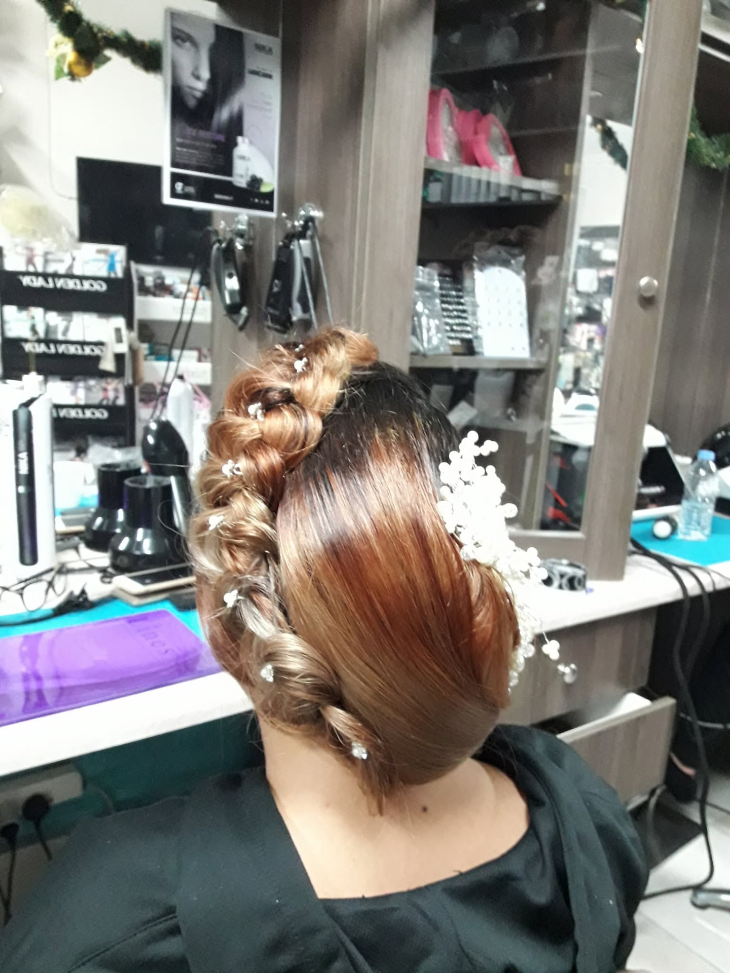 Dutch braid hair updo with pearl hairpins and accessories